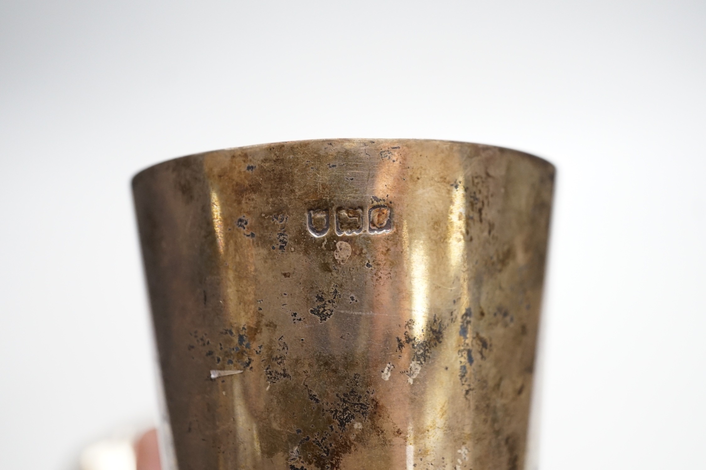 A late Victorian silver beaker, with later engraved inscription, London, 1898, 9.8cm and a 1970's silver small dish, 6.1oz.